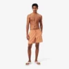 Boxers de banho de comprimento médio com padrão de crocodilo