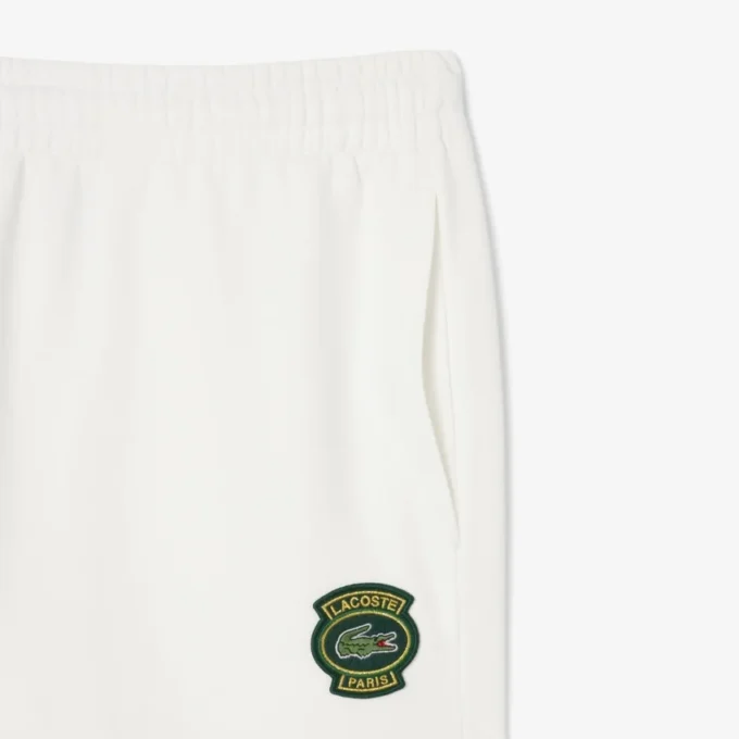 Calças de moletom com emblema em malha polar para homem