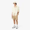 Calções bermudas chino em algodão elástico com corte regular