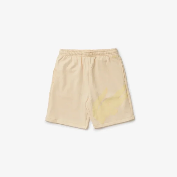 Calções oversize de malha polar de algodão orgânico com estampado de crocodilo para homem