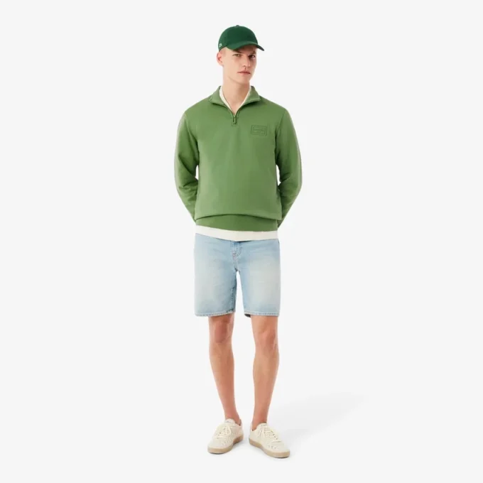 Camisola com gola alta e fecho em relevo