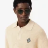 Camisola com gola polo em malha canelada com detalhes em pérola