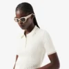 Camisola com gola polo em malha trançada às riscas