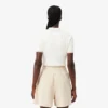 Camisola com gola polo em malha trançada às riscas