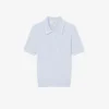 Camisola com gola polo em malha trançada às riscas