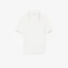 Camisola com gola polo em malha trançada às riscas