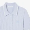 Camisola com gola polo em malha trançada às riscas
