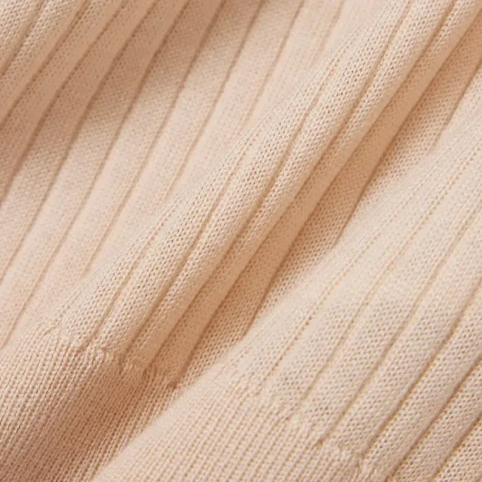 Camisola de lã merino com gola polo em malha canelada 3D