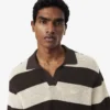 Camisola de manga curta com gola polo às riscas
