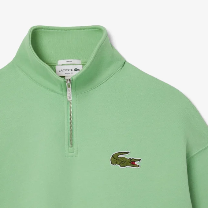Camisola unissexo de corte largo com fecho de correr até meio e emblema