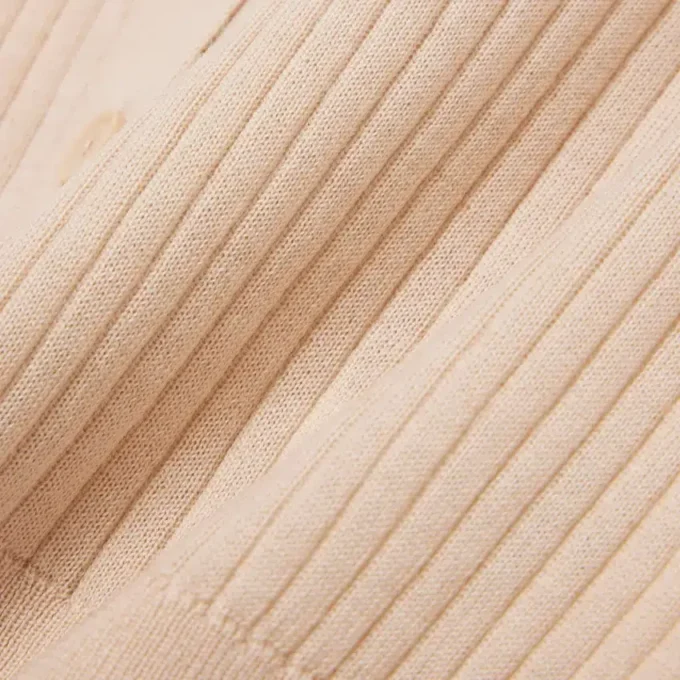 Casaco de malha canelada em lã merino para mulher