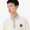 Fabricado em França Polo com emblema de corte clássico