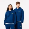 Hoodie unissexo de corte largo com detalhe de emblema