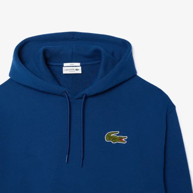 Hoodie unissexo de corte largo com detalhe de emblema