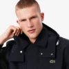 Parka com capuz repelente de água de comprimento médio para homem