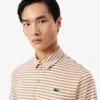 Polo de golfe com riscas Ultra Dry de corte regular