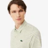 Polo de golfe com riscas Ultra Dry de corte regular
