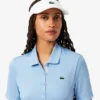 Polo de golfe feminino slim fit com proteção UV e tecido elástico