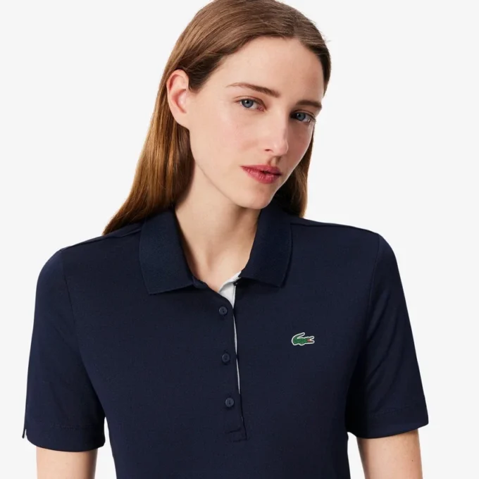 Polo de golfe feminino slim fit com proteção UV e tecido elástico