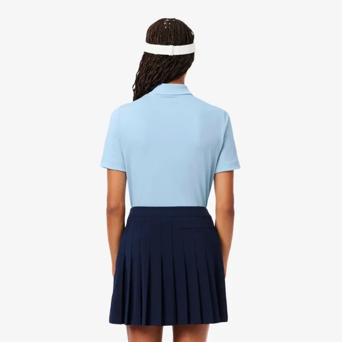 Polo de golfe feminino slim fit com proteção UV e tecido elástico