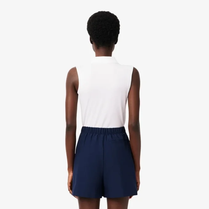 Polo de golfe feminino slim fit com proteção UV e tecido elástico