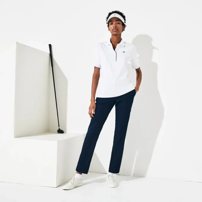 Polo de golfe feminino slim fit com proteção UV e tecido elástico