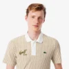 Polo de golfe às riscas com termorregulação para homem