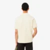 Polo de malha com efeito de cetim e corte largo com emblema