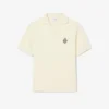 Polo de malha com efeito de cetim e corte largo com emblema