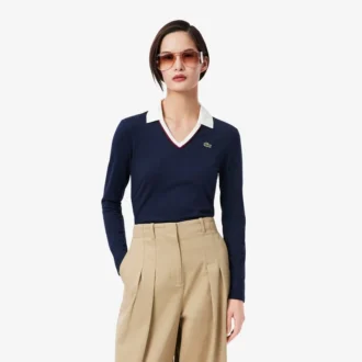 Polo de manga comprida com corte justo e detalhes de acabamento para mulher