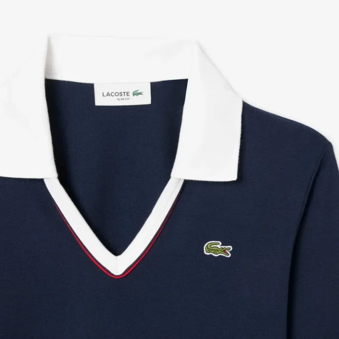 Polo de manga comprida com corte justo e detalhes de acabamento para mulher