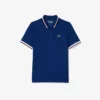 Polo de ténis com gola às riscas e proteção UV para mulher