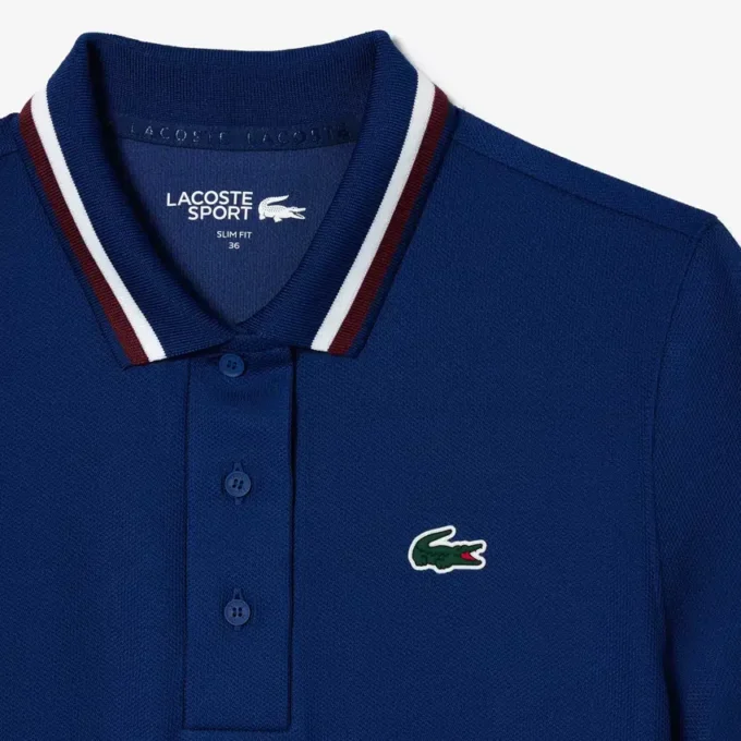 Polo de ténis com gola às riscas e proteção UV para mulher