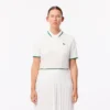 Polo de ténis com gola às riscas e proteção UV para mulher