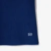 Polo de ténis com gola às riscas e proteção UV para mulher