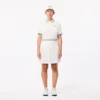 Polo de ténis com gola às riscas e proteção UV para mulher