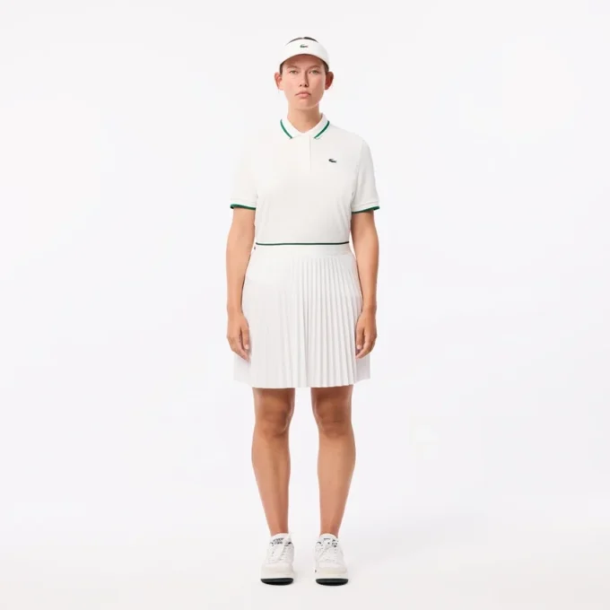 Polo de ténis com gola às riscas e proteção UV para mulher