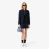Polo feminino L.12.D de corte justo com detalhes de acabamento