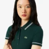 Polo feminino L.12.D de corte justo com detalhes de acabamento