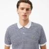 Polo L.12.12 às riscas em malha Petit Piqué de corte clássico para homem