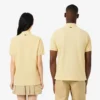Polo L.12.12 unissexo de corte clássico com estampado exclusivo