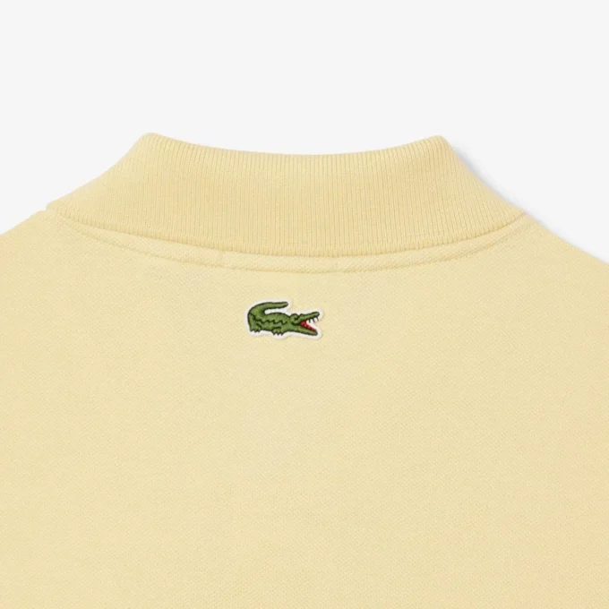 Polo L.12.12 unissexo de corte clássico com estampado exclusivo