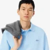 Polo masculino de corte largo em piqué pesado