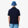 Polo masculino de corte largo em piqué pesado