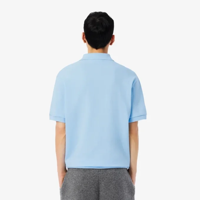 Polo masculino de corte largo em piqué pesado