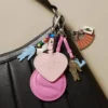 Porta-chaves com pingente em forma de raquete de ténis e espelho L