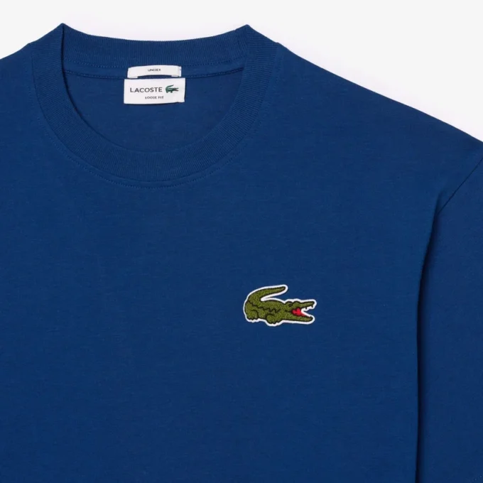 T-shirt unissexo de corte largo em algodão pesado com emblema